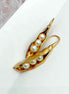 Vintage-style gold earrings with pea pod design