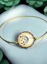 Eleganter Armreif mit Pusteblumen-Glascabochon