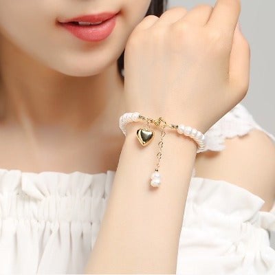Süßwasserperlenarmband mit vergoldetem Herzanhänger