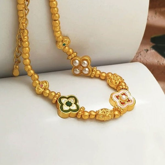 vergoldetes Armband mit Kleeblatt Emblemen