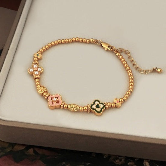 vergoldetes Armband mit Kleeblatt Emblemen