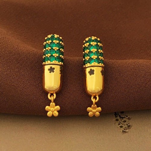 Capsule design earrings with green stones