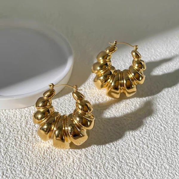 Grandes boucles d'oreilles créoles en forme de croissant
