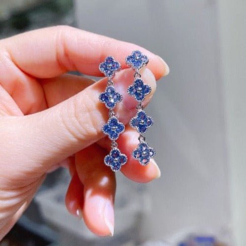 Long drop earrings with blue lucky clover